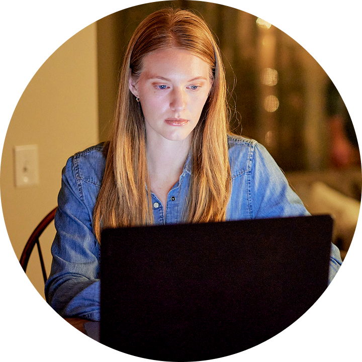 Image of Rose at home on her laptop completing steps in the leave portal.